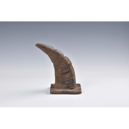 2096 - Tribal art - A carved horn figure of a dancer in an elephant mask, with brass coin button to the bel... 