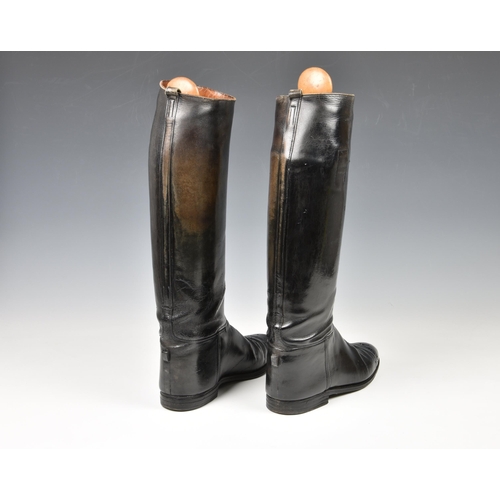 2119 - A pair of black leather riding boots with wooden stretchers, c.1965, made by Long Buckby Shoes Ltd, ... 