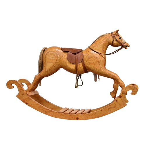 2121 - A contemporary laminated plywood rocking horse, bow type, with real horse hair mane etc, leather sad... 