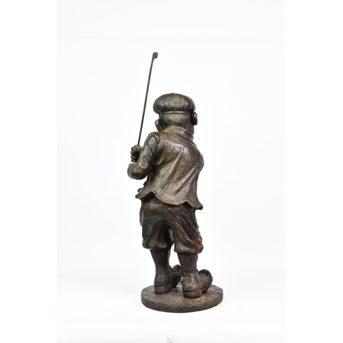 2143 - A large cast iron figure of a comical golfer, bronzed finish, holding a club, 34in. (86.4cm.) at hig... 