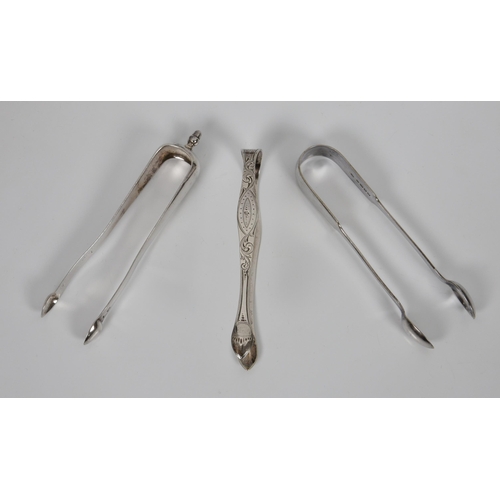 215 - Three pairs of silver sugar tongs, to include a pair of Georgian bright cut tongs, Peter & Ann Batem... 