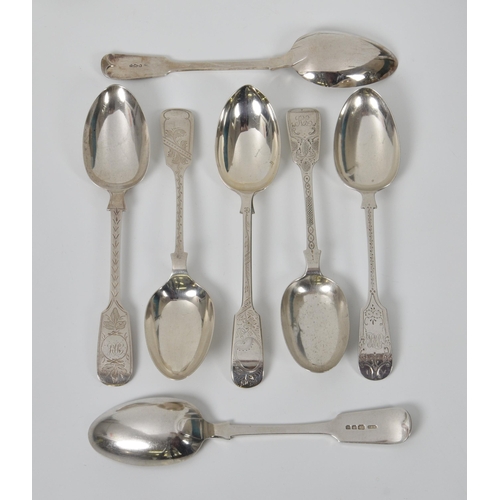 219 - Seven Victorian / Edwardian and later silver bright cut fiddle pattern table spoons, to include two ... 