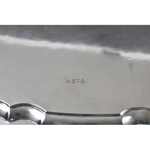 229 - An Edwardian twin handle silver tray, Barker Brothers, Chester 1908, oval form with pie-crust rim, e... 