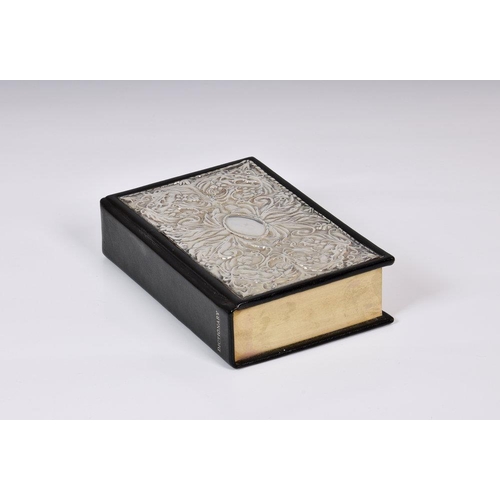 233 - A silver mounted Oxford dictionary, John Bull Ltd., Sheffield 1990, the silver mounted cover heavily... 