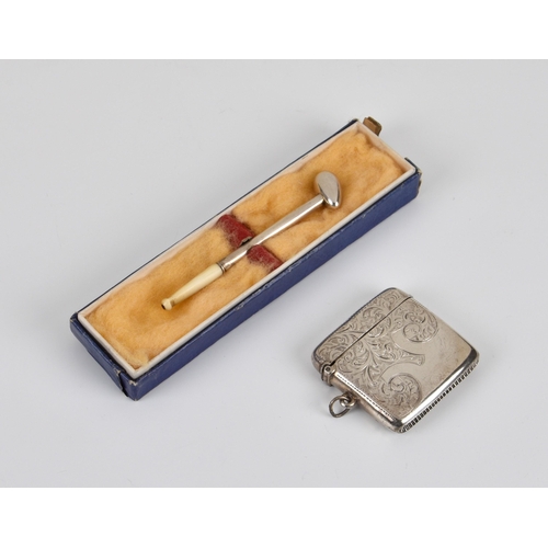 235 - An Edwardian silver vesta case and miniature pipe, the vesta case of square form, engraved with foli... 