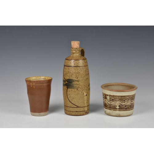 29 - Peter Arnold for Alderney Pottery - three stoneware studio pottery pieces, comprising an oil bottle,... 