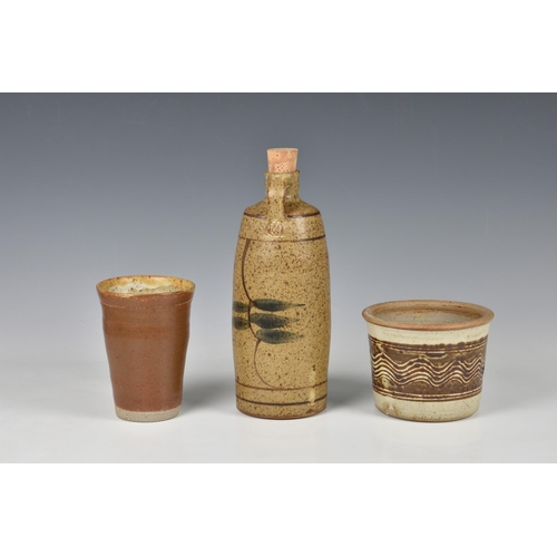 29 - Peter Arnold for Alderney Pottery - three stoneware studio pottery pieces, comprising an oil bottle,... 