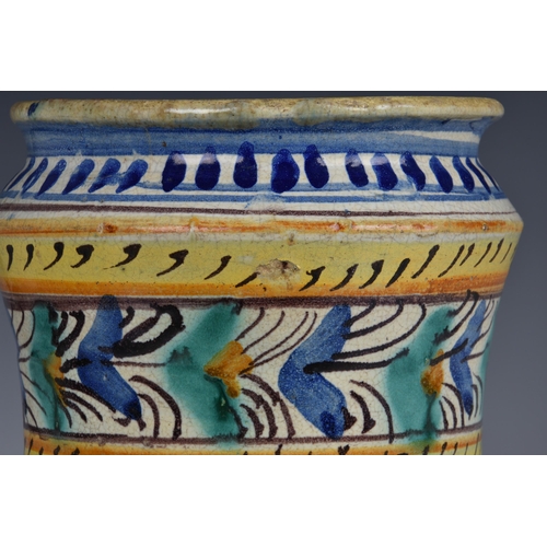 31 - An Italian maiolica polychrome albarello, 17th / 18th century, of slightly waisted form with flared ... 