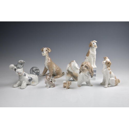 42 - Seven figures of dogs by Lladro and Nao, including three large figures by Lladro, two slightly small... 