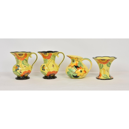 49 - A pair of Wade Heath 1930s sunflower pattern hand painted jugs, 7 ¾ in. (19.7cm.) high, with matchi... 