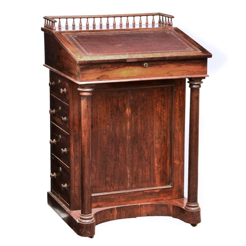 696 - A George IV rosewood Davenport, 23½ x 20½in. (59 x 52cm.), 35½in. (90cm.) high.. *