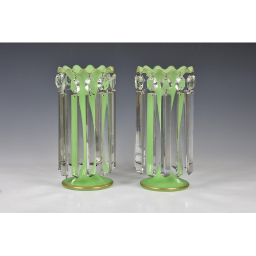 72 - A pair of Victorian green glass table lustres, the opaque, pale green glass vases with gilt, scallop... 