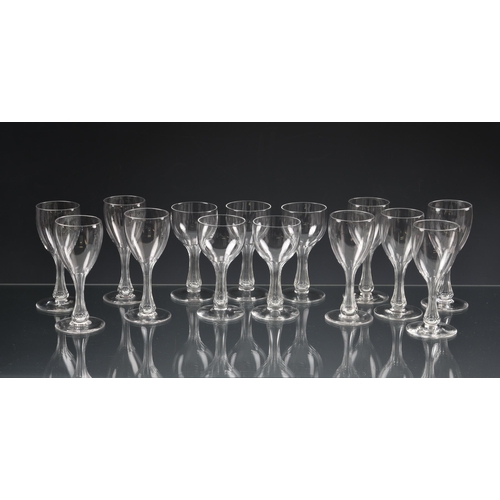 74 - *** WITHDRAWN *** A matching set of nine Edwardian hollow stem port or sherry glasses, the drawn, ov... 