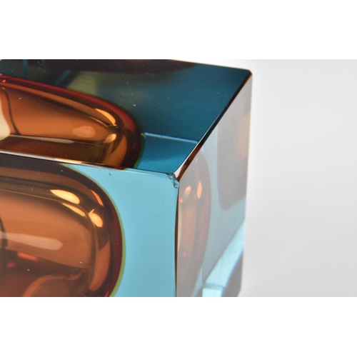 83 - A 1960s square art glass paperweight style vase, in blue and orange, 3¾in. (9.5cm.) high.. * Scratch... 