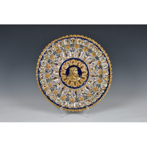 93 - An Italian Urbino style maiolica charger, 20th century, painted with a king's head to the centre of ... 