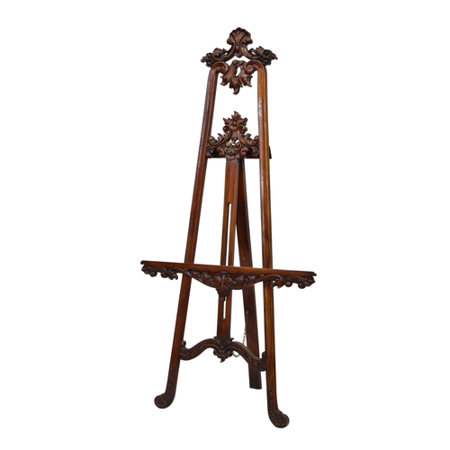 2278 - A French style carved mahogany artist's easel late 20th century, the moulded frame with carved folia... 