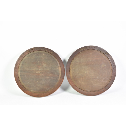 61 - A pair of Copeland Spode Chargers in wooden circular frames, probably concealing marks and titles on... 