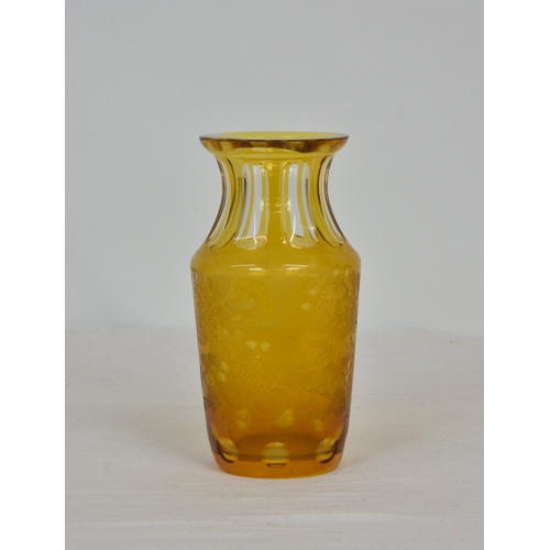 88 - An amber cut-glass vase with flash cut flared neck, finely engraved with central cartouches, running... 