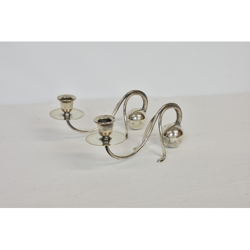 122 - A pair of German Jugenstil silver plated candlesticks, designed by Carl Deffner (1856-1948), 9¼in. (... 