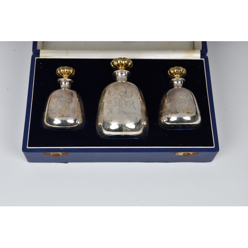 139 - A cased set of three Elizabeth II Silver Jubilee scent / perfume bottles by Asprey, London, 1977, ea... 