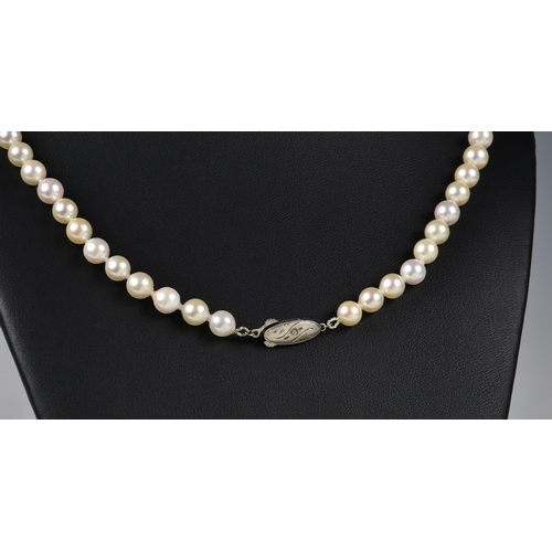 1222 - A single strand Akoya cultured pearl necklace, the 6mm. pearls of good even lustre, the tone varying... 