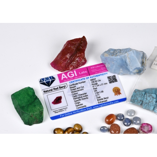 1053 - A collection of cut and uncut gemstones, including an approx. 158.5ct red beryl rough stone with AGI... 