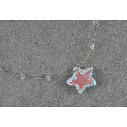 1258 - A Baccarat opaline glass star and silver necklet, the star with etched 'Baccarat' mark, on a silver ... 