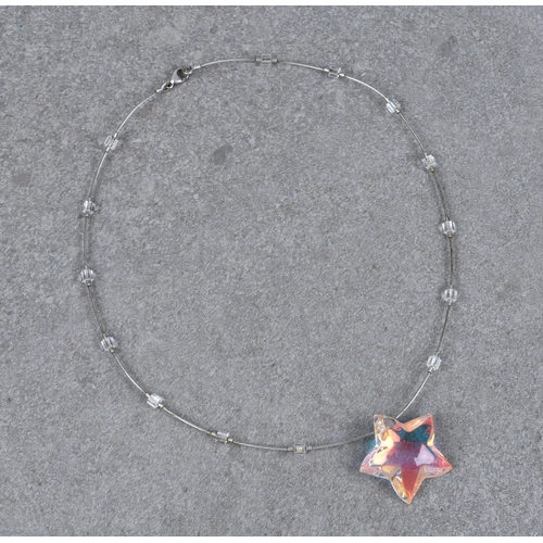 1258 - A Baccarat opaline glass star and silver necklet, the star with etched 'Baccarat' mark, on a silver ... 