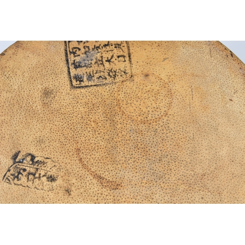 1504 - A Japanese Taiko war drum, probably 19th century, the brass rivetted, vellum skins with black painte... 