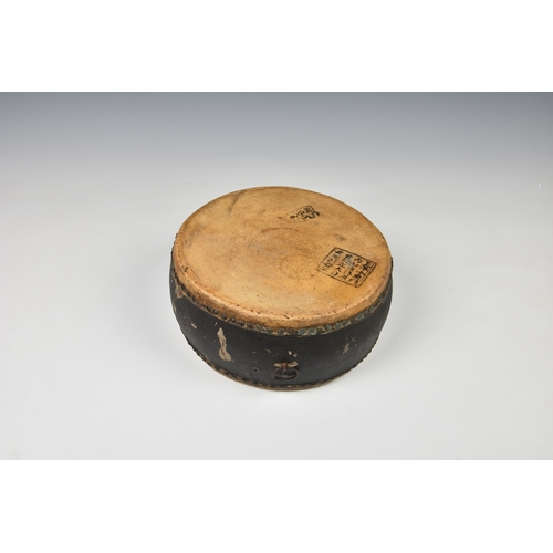 1504 - A Japanese Taiko war drum, probably 19th century, the brass rivetted, vellum skins with black painte... 