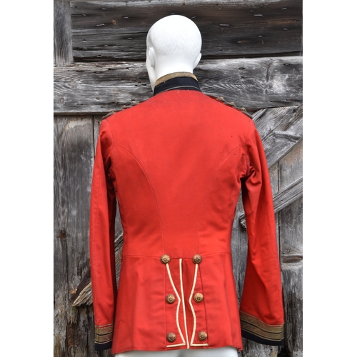 1829 - A 2nd Royal Guernsey Light Infantry scarlet jacket, navy blue collar with leopards passant to either... 