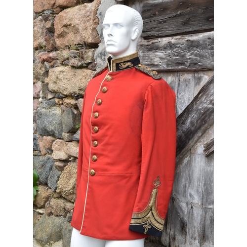 1829 - A 2nd Royal Guernsey Light Infantry scarlet jacket, navy blue collar with leopards passant to either... 