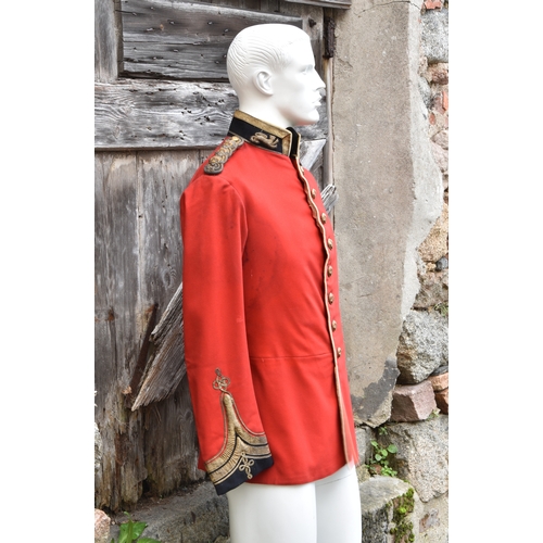 1829 - A 2nd Royal Guernsey Light Infantry scarlet jacket, navy blue collar with leopards passant to either... 