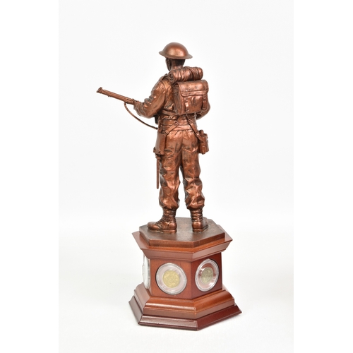 1911 - Danbury Mint "The Defender" painted resin sculpture on wooden plinth, with five period coi... 