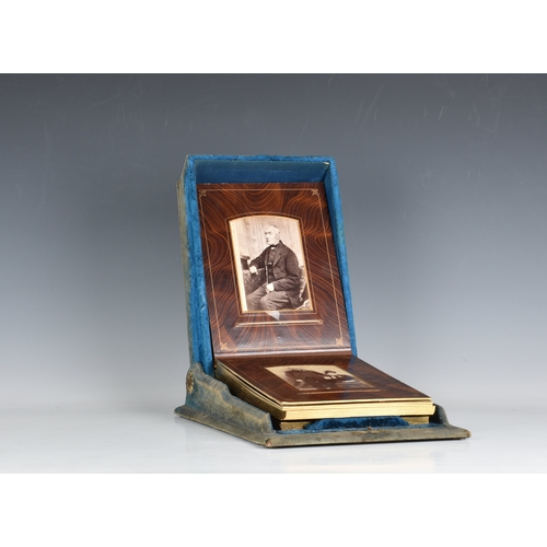 2007 - A Victorian blue velvet patented box form photograph album, the shaped box with mirrored roundel to ... 