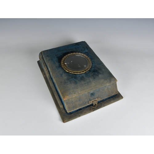 2007 - A Victorian blue velvet patented box form photograph album, the shaped box with mirrored roundel to ... 