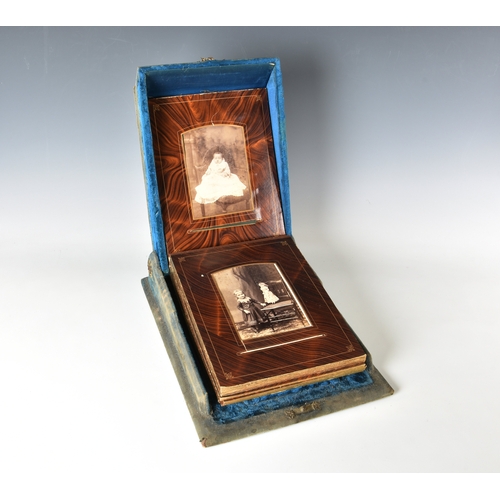 2007 - A Victorian blue velvet patented box form photograph album, the shaped box with mirrored roundel to ... 