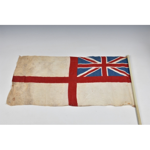 2029 - Three 1940s handheld Union jack linen flags, the largest 27 15in. (68.z x 38.2cm.), together with a ... 