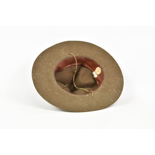 2124 - An early 20th century Boy Scouts Stetson hat, with leather strap and badges, brim 14in. (35.6cm.) wi... 