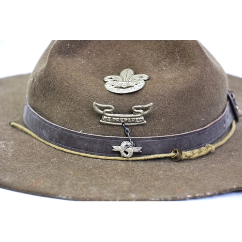 2124 - An early 20th century Boy Scouts Stetson hat, with leather strap and badges, brim 14in. (35.6cm.) wi... 