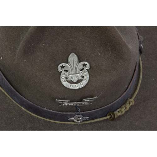 2124 - An early 20th century Boy Scouts Stetson hat, with leather strap and badges, brim 14in. (35.6cm.) wi... 