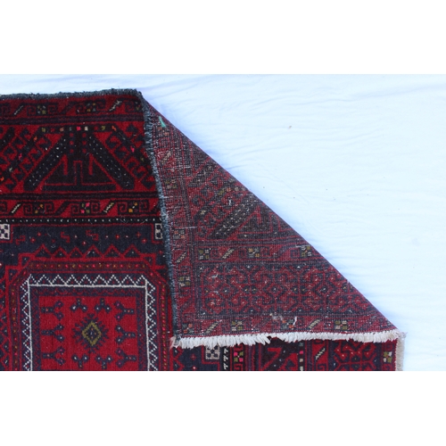 2176 - A two medallion Turkoman rug on red ground, with repeat unresolved S-borders and birth symbol elem, ... 