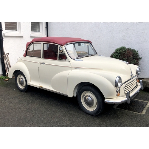 1770 - A 1960 Morris Minor Convertible, cream paintwork with red pinstripe, contrasting red interior and bo... 