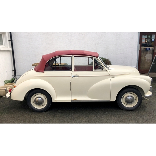 1770 - A 1960 Morris Minor Convertible, cream paintwork with red pinstripe, contrasting red interior and bo... 