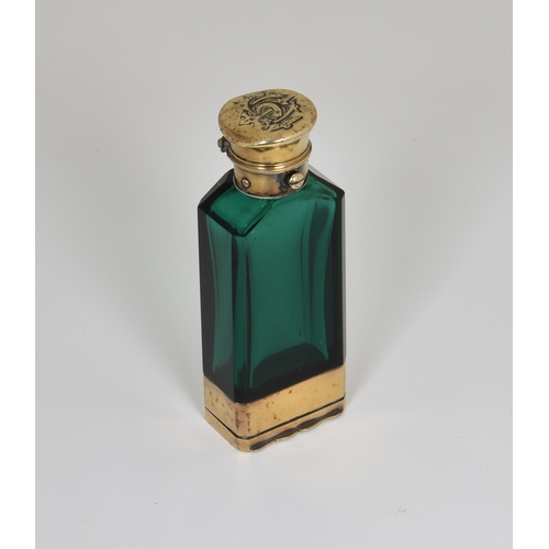 11 - A rare Victorian silver-gilt mounted faceted emerald glass novelty combination scent bottle and vina... 