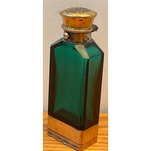 11 - A rare Victorian silver-gilt mounted faceted emerald glass novelty combination scent bottle and vina... 