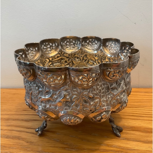 13 - A footed Indian silver bowl, of shaped circular lobed form, raised on three entwined fish feet, with... 