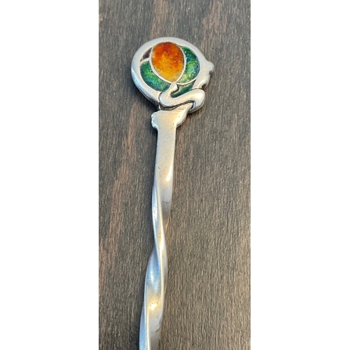 28 - A Liberty & Co silver and enamel spoon, Birm. 1903, with stylised enamel finial / terminal in rich e... 