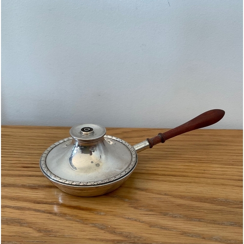 32 - A novelty silver Elizabeth II silver table lighter, fashioned as a saucepan or bed pan with turned h... 