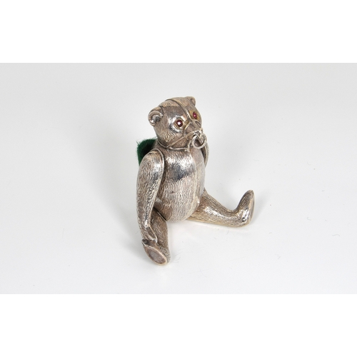 44 - An Edwardian novelty silver pin cushion in the form of a muzzled bear, H V Pithey & Co, Birm. 1908, ... 